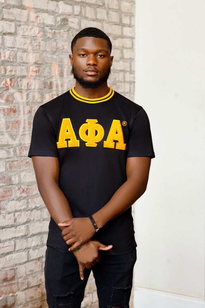 Black & Gold AΦΑ Chenille Tee: Soft premium cotton with embroidered logo. True to size; model wears size medium.