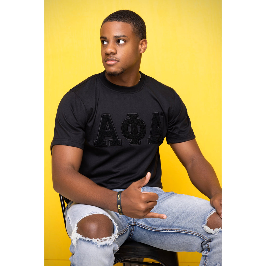 Solid Black ΑΦΑ Chenille Tee: Soft cotton t-shirt featuring an embroidered logo for a durable, high-quality appearance