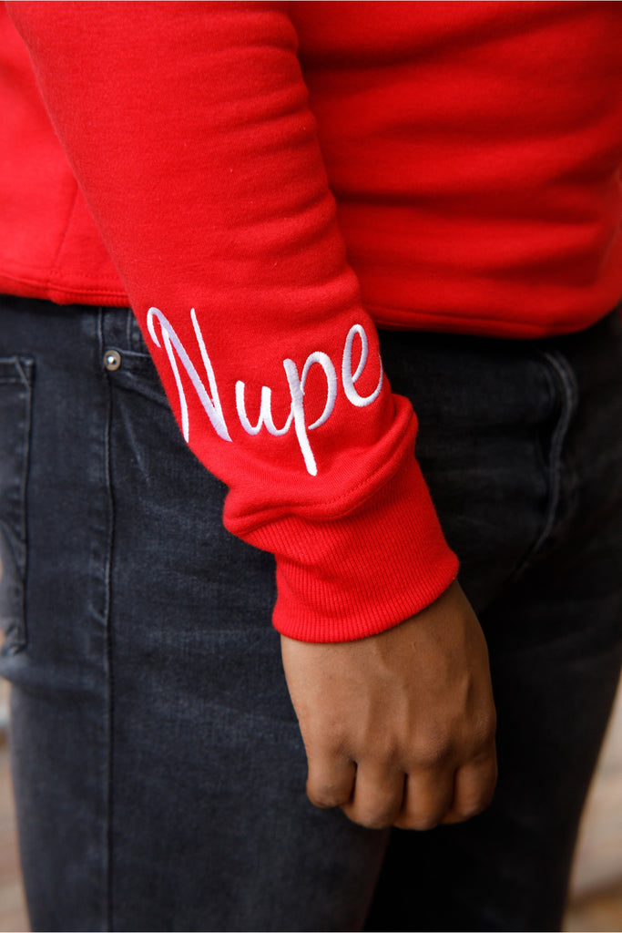 Image of a man wearing HBCU Nupe Chenille Sweatshirt, showcasing the unique sleeves.
